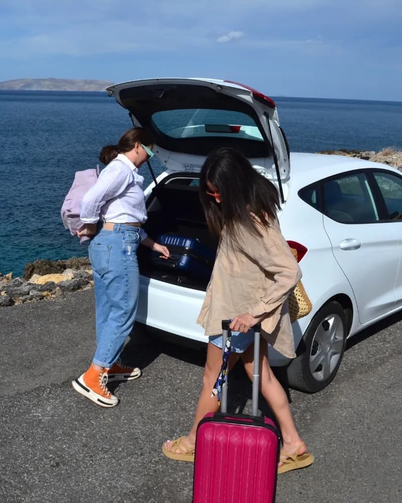 Friends loading luggage into Ford Fiesta in Crete